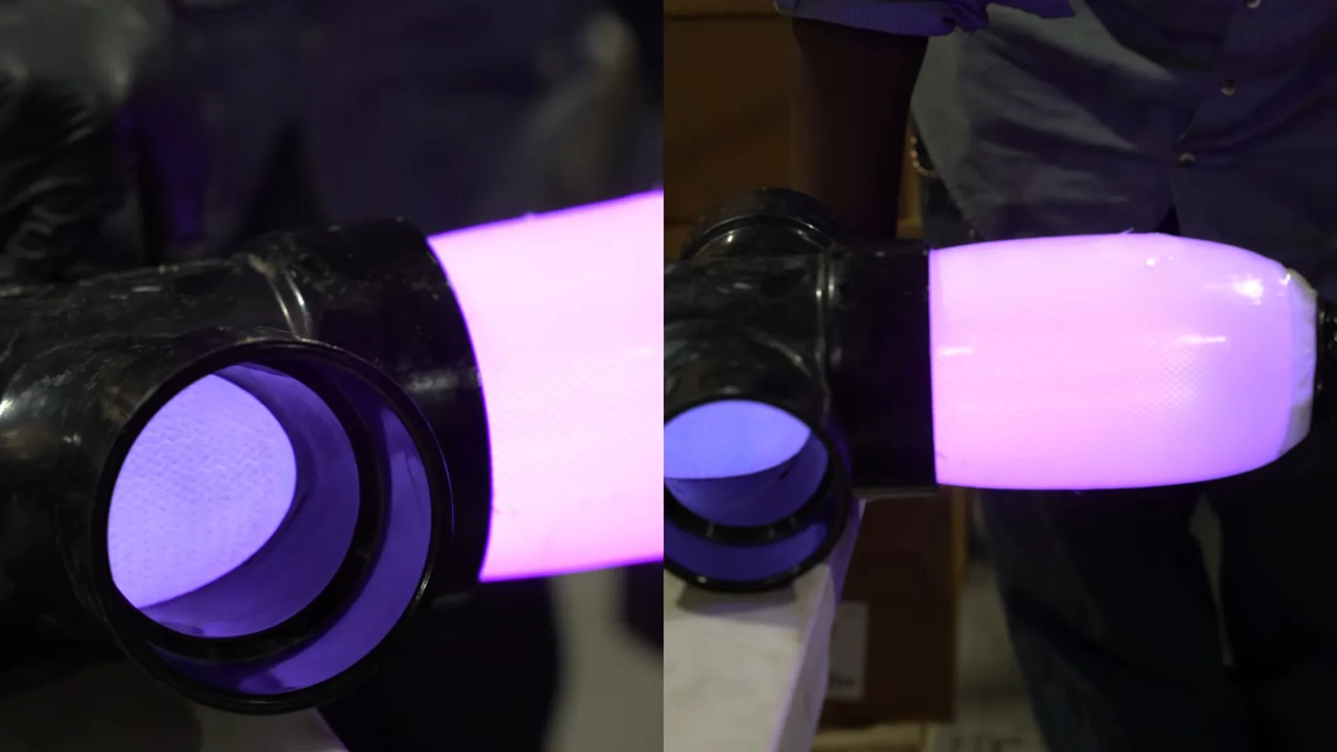 Violet light glowing inside two black pipe ends as a liner cures